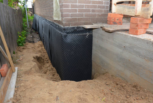 Happy homeowners after waterproofing job in Gore